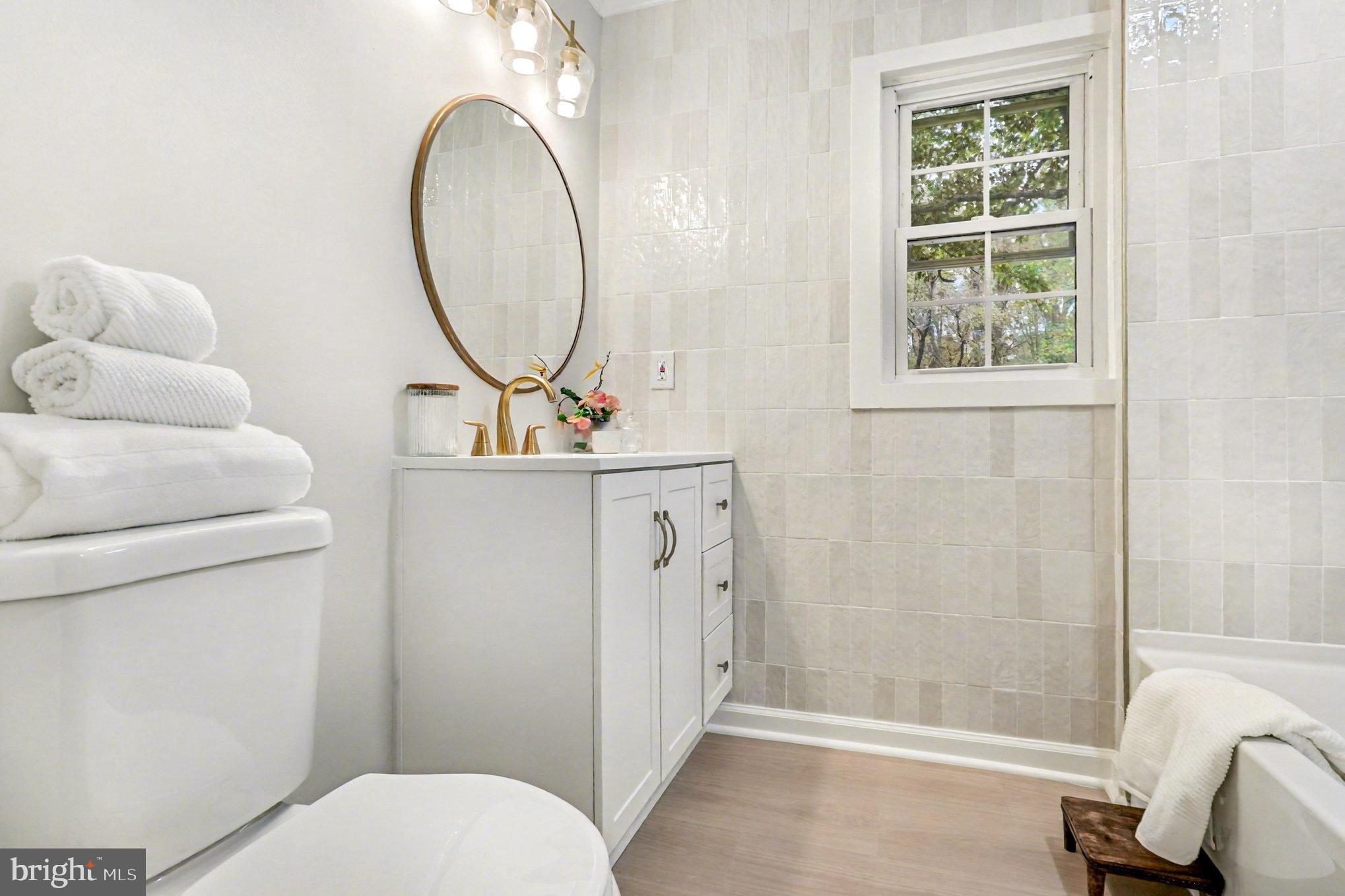 846 Borden Road Bumpass, VA 23024 - Photo 25 of 32 a bathroom with a sink toilet and a mirror