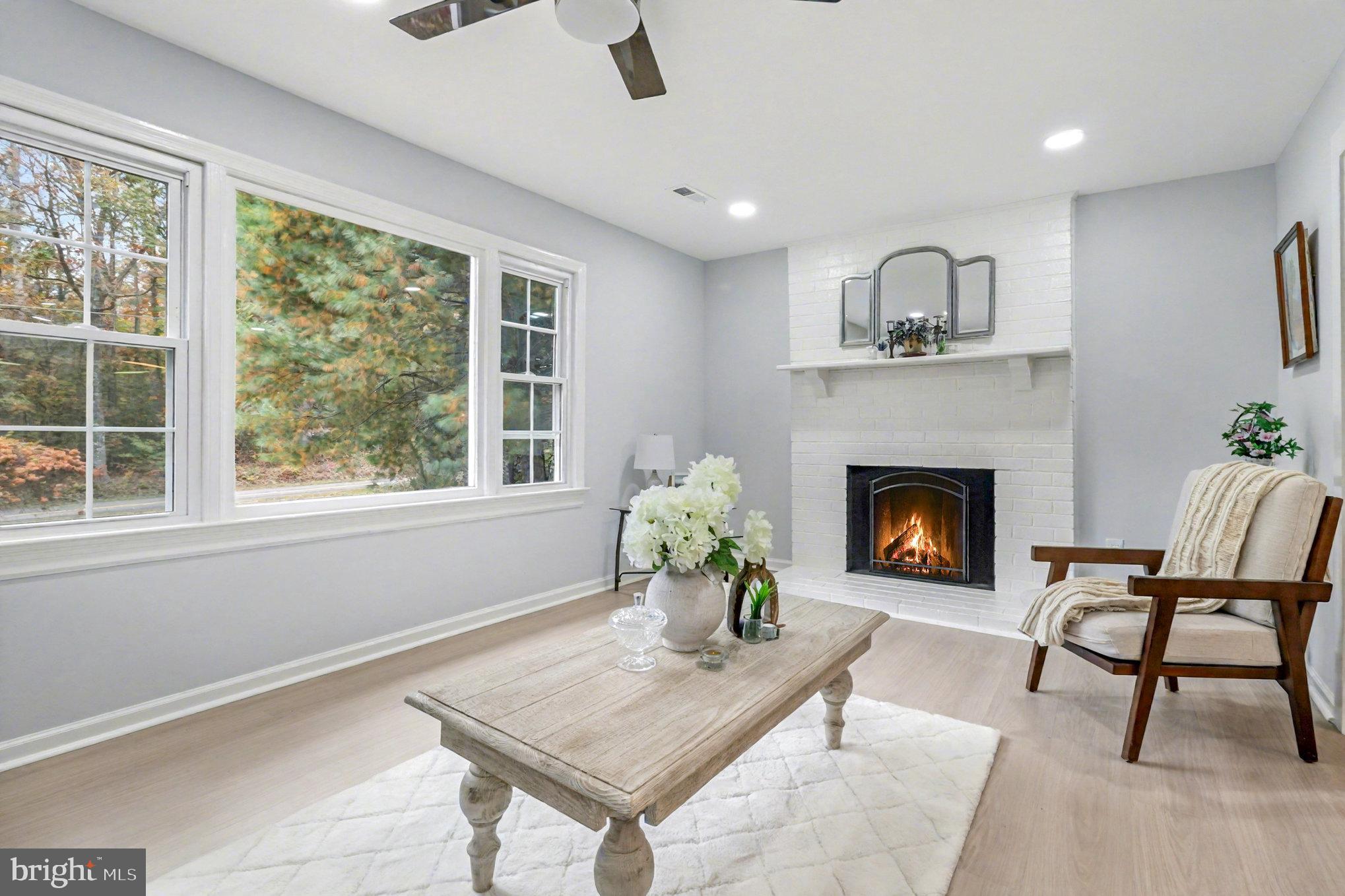 846 Borden Road Bumpass, VA 23024 - Photo 10 of 32 a living room with furniture and a fireplace