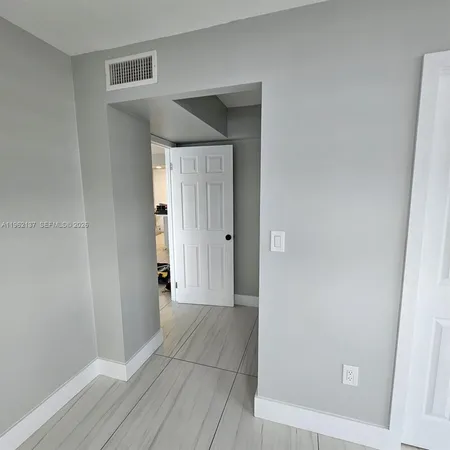 wooden floor and closet in a room