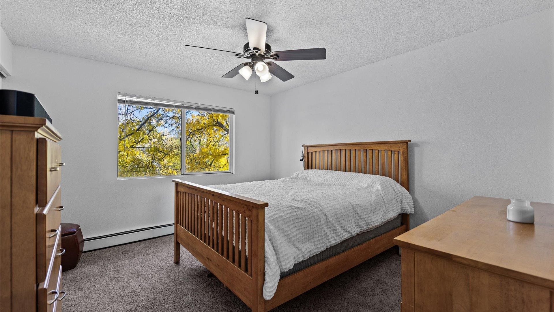 510 Coronado Court, Unit R Clifton, CO 81520 - Photo 12 of 20 a bedroom with a bed and a window