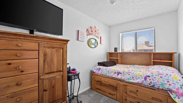 a bedroom with a bed and cabinets