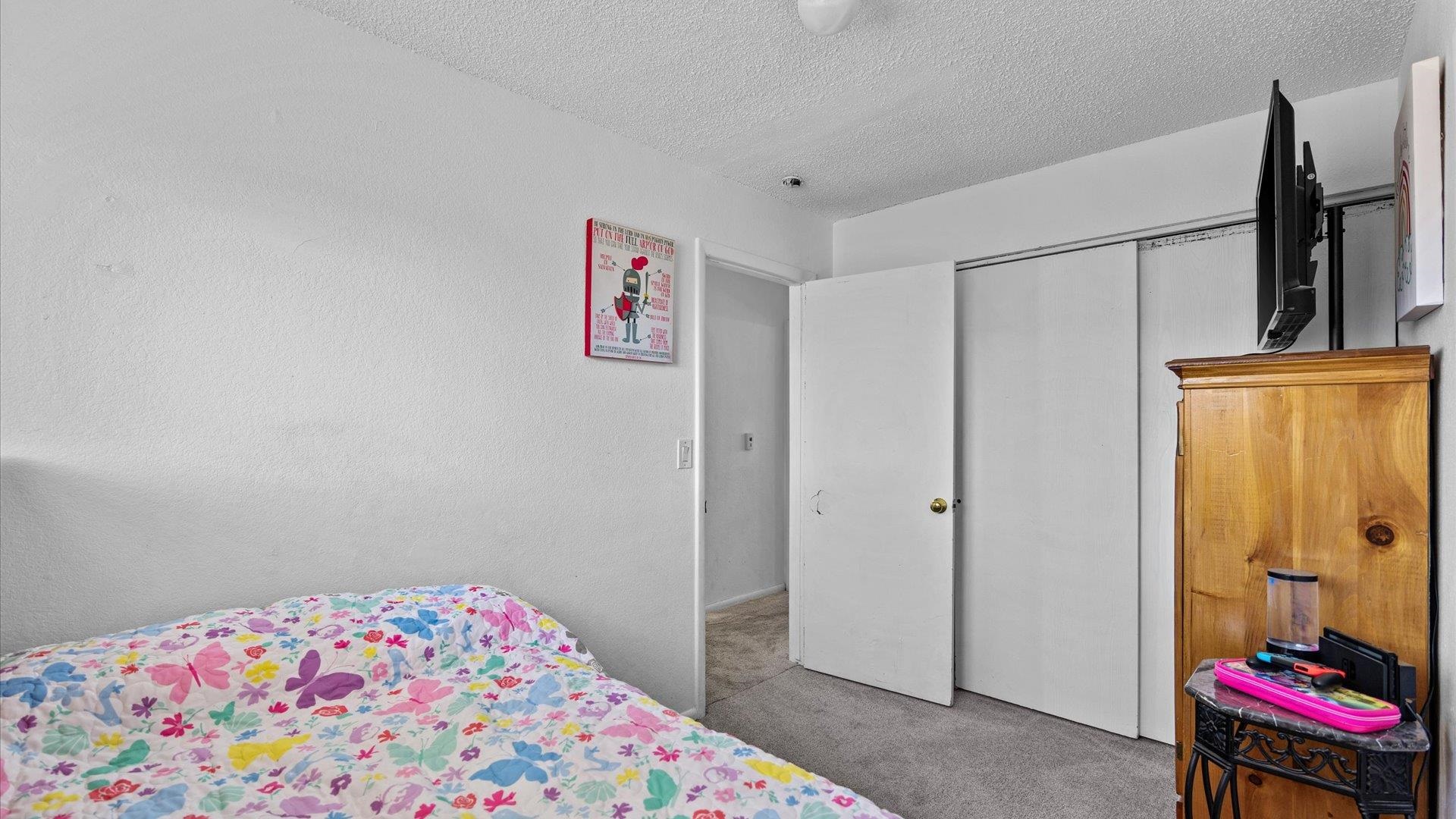 510 Coronado Court, Unit R Clifton, CO 81520 - Photo 15 of 20 a bedroom with a bed and furniture