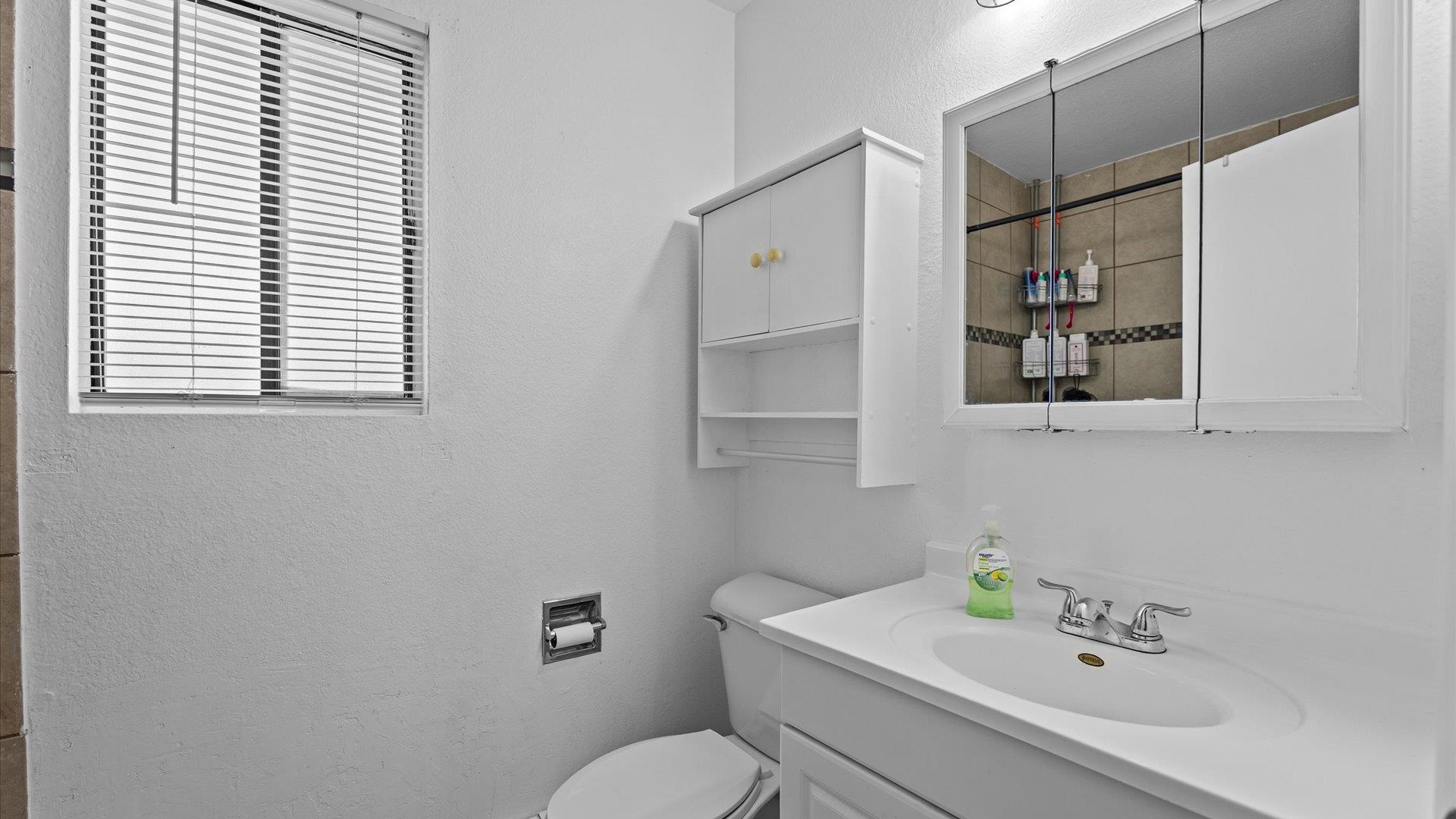 510 Coronado Court, Unit R Clifton, CO 81520 - Photo 16 of 20 a white toilet sitting next to a bathroom sink