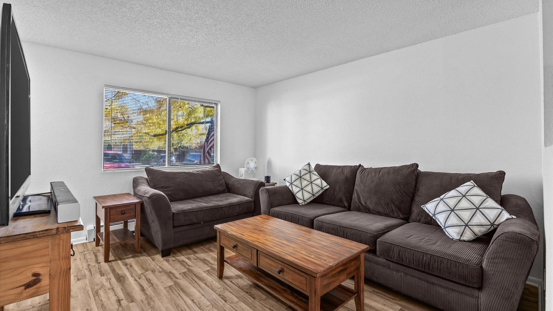 510 Coronado Court, Unit R Clifton, CO 81520 - Photo 5 of 20 a living room with furniture and a large window