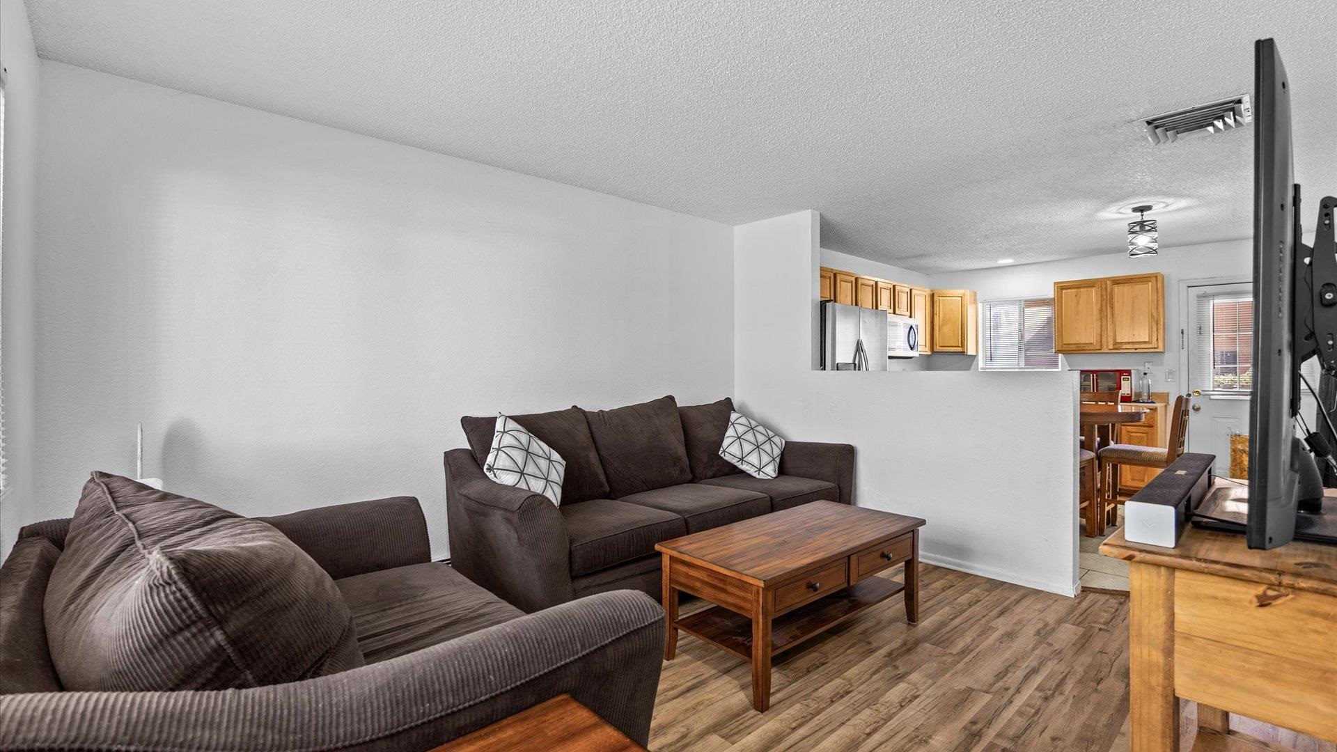 510 Coronado Court, Unit R Clifton, CO 81520 - Photo 6 of 20 a living room with furniture and a wooden floor