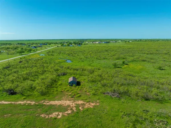 a view of an ocean and yard