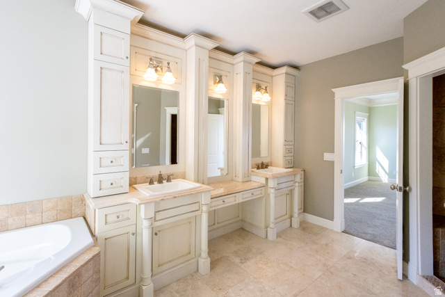 434 Cardon Ridge Drive Smithfield, UT 84335 - Photo 21 of 59 Bathroom featuring vanity, a garden tub, and crown molding