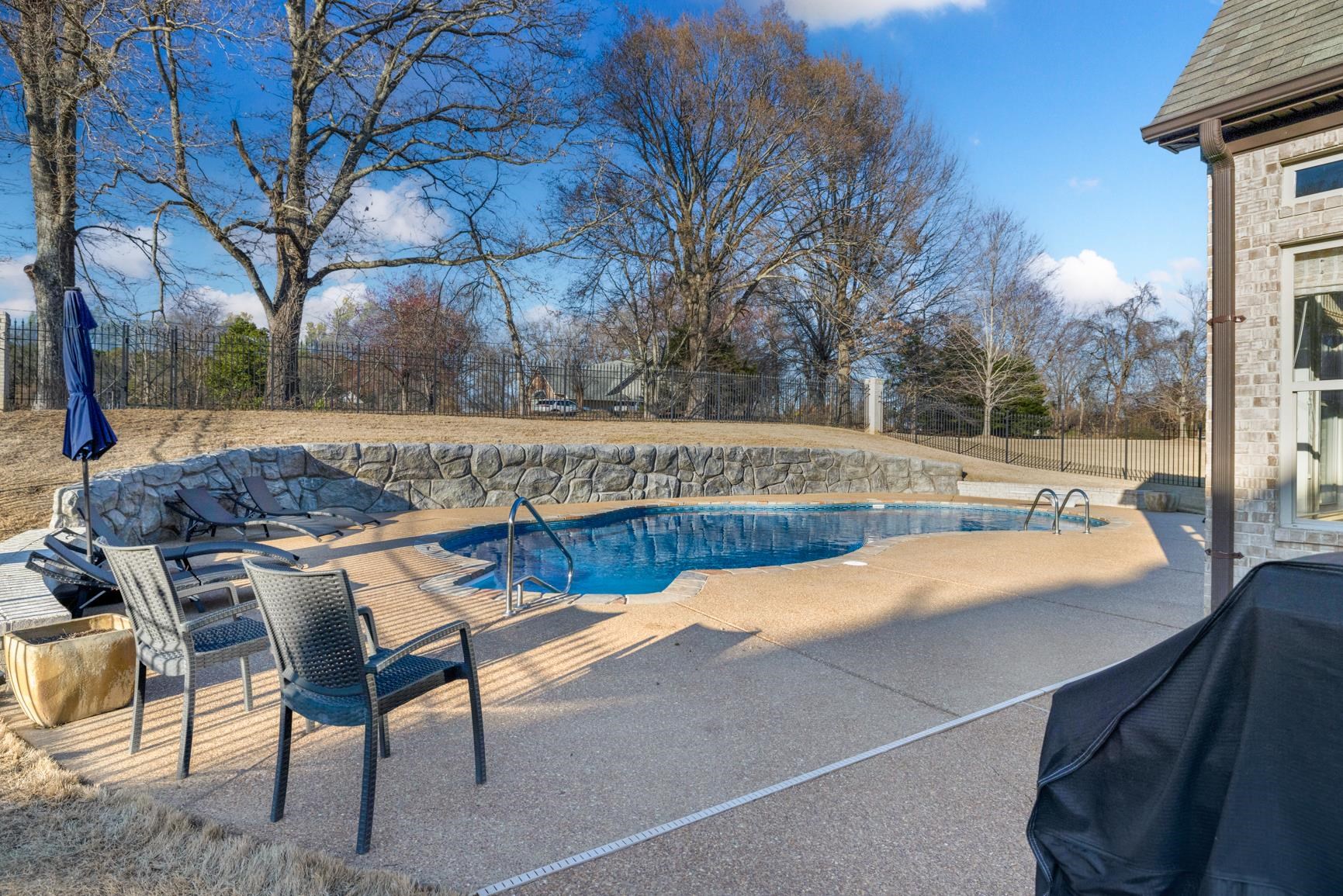 104 Eagle Trace Road Covington, TN 38019 - Photo 37 of 40 View of pool featuring a fenced backyard and patio surround