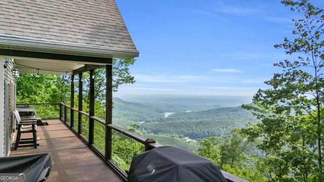 a view of a porch with wooden floor and outdoor space