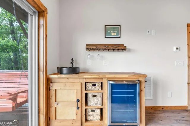 a bedroom with furniture and baby crib