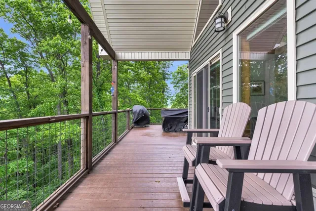 a view of a balcony with wooden floor