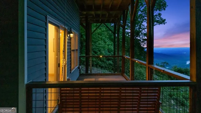 a backyard of a house with lots of green space and mountain view