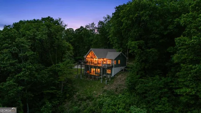 a backyard of a house with lots of green space and mountain view