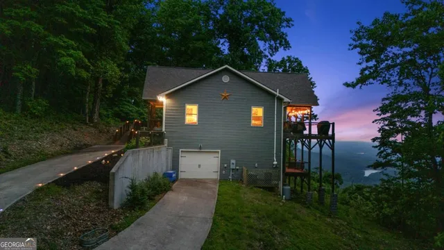view of a house with pool and garden