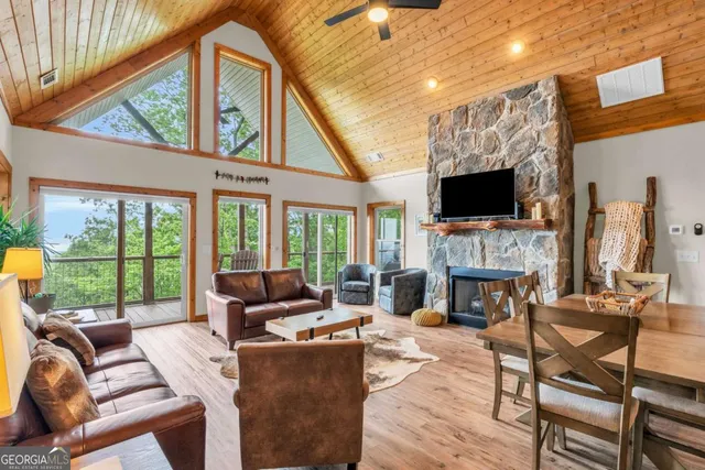 a living room with stainless steel appliances kitchen island granite countertop furniture and a kitchen view