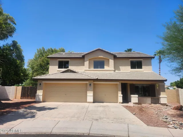 a front view of a house with yard