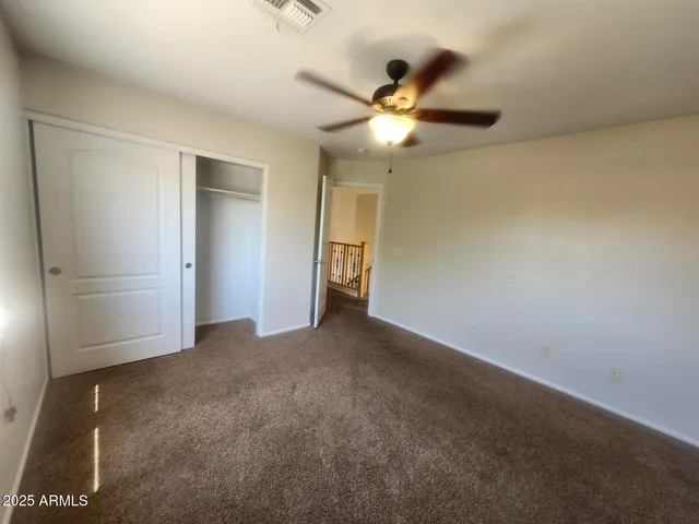 a bathroom with a tub a sink and mirror