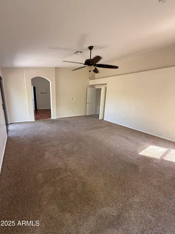a spacious bathroom with a double vanity sink and a mirror