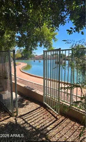 a view of a swimming pool with a yard