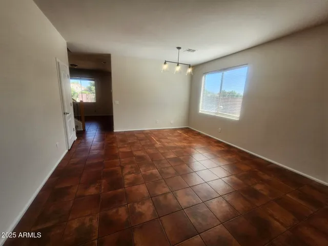 a kitchen with granite countertop a refrigerator and a sink