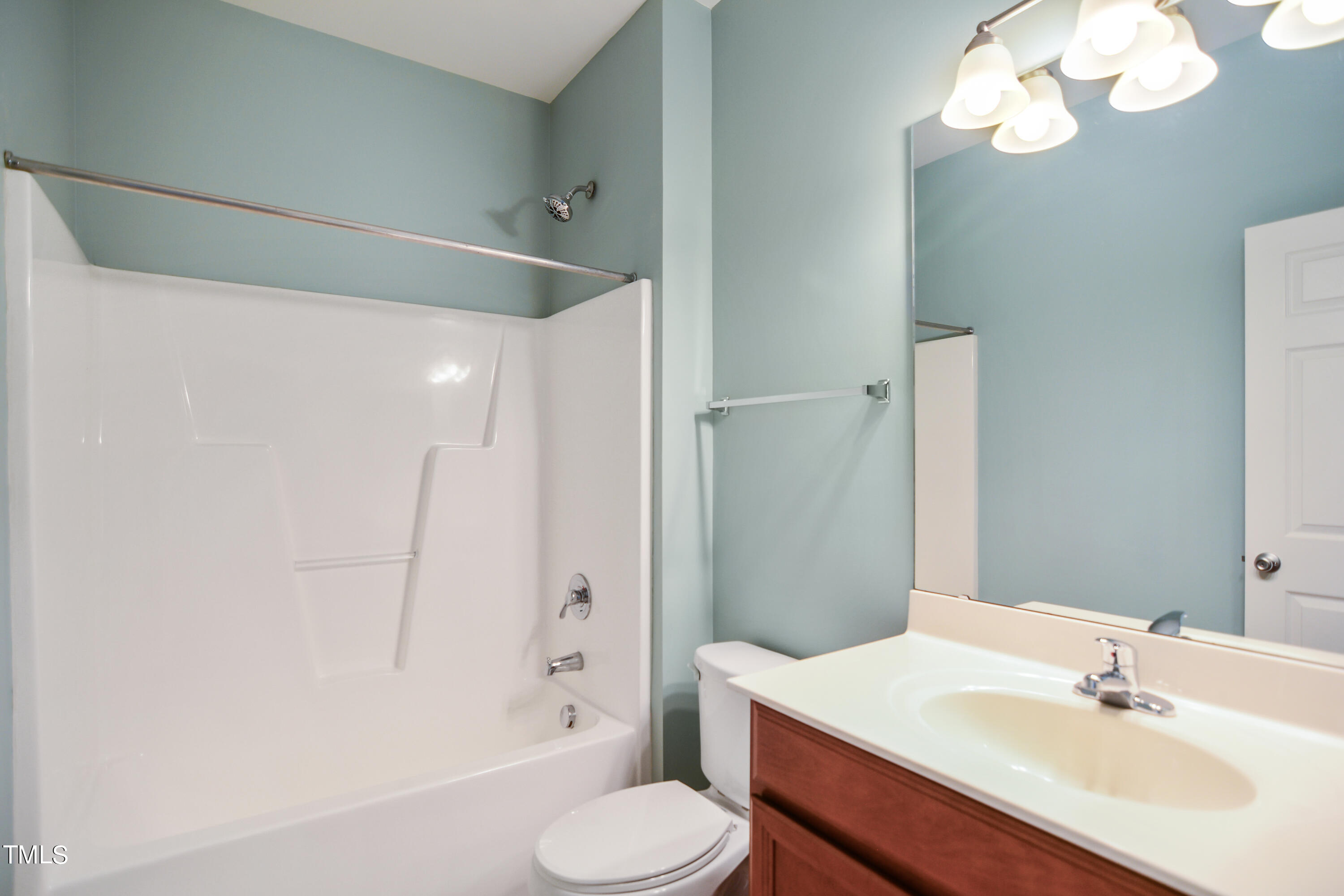 207 Idlewild Avenue Raleigh, NC 27601 - Photo 11 of 14 a bathroom with a sink toilet mirror and shower