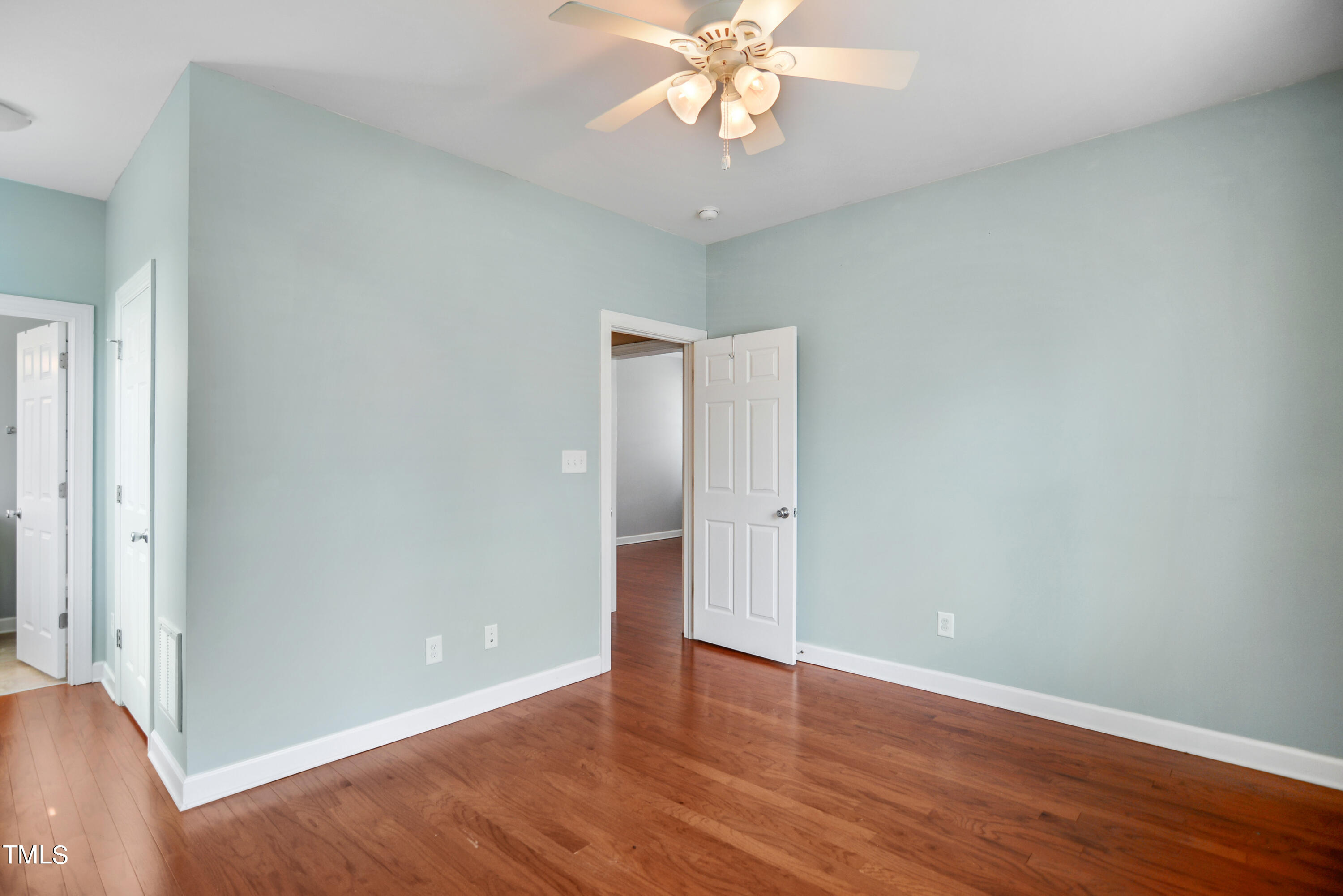 207 Idlewild Avenue Raleigh, NC 27601 - Photo 8 of 14 a view of an empty room with wooden floor
