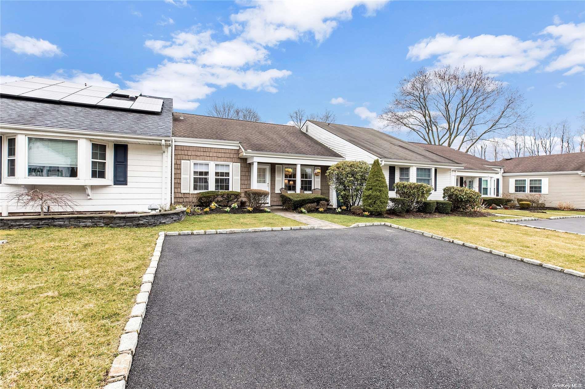 a view of house with outdoor space and swimming pool
