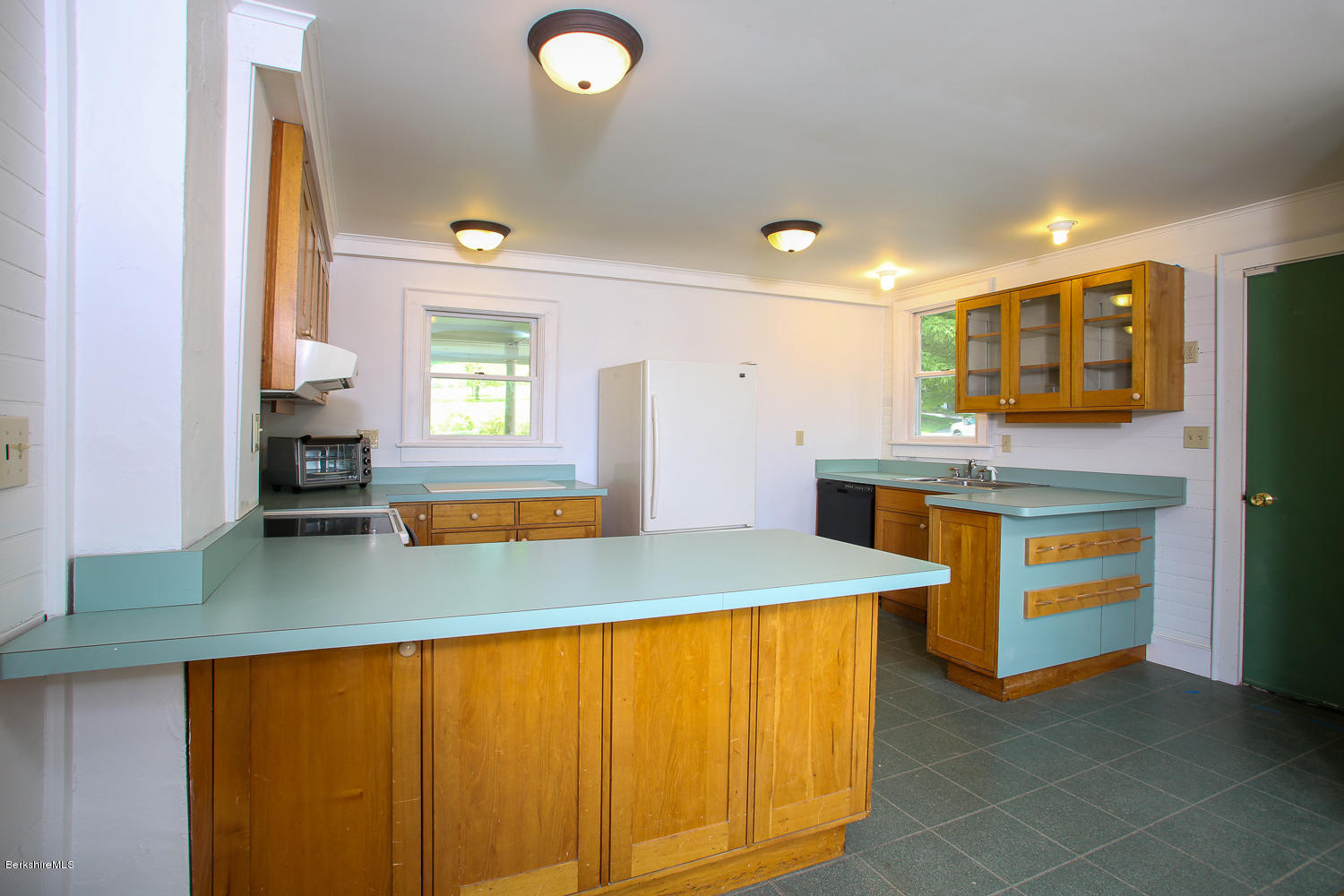 837 Murray Road Ashfield, MA 01330 - Photo 5 of 37 a kitchen with stainless steel appliances granite countertop a sink and a wooden cabinets
