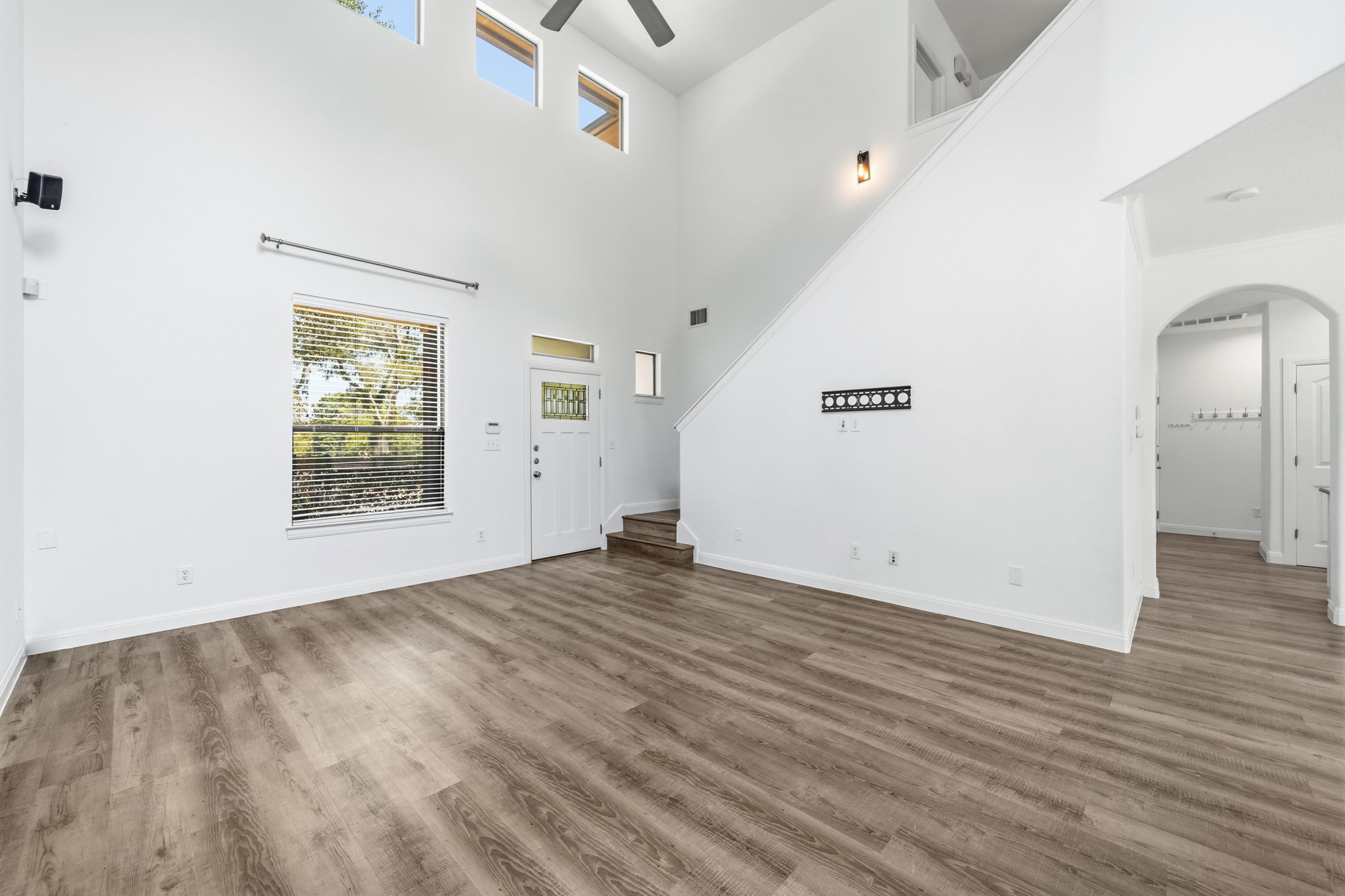 6708 Manchaca Road, Unit 4 Austin, TX 78745 - Photo 3 of 25 Soaring ceilings and warm wood floors define this airy living space near the entry.