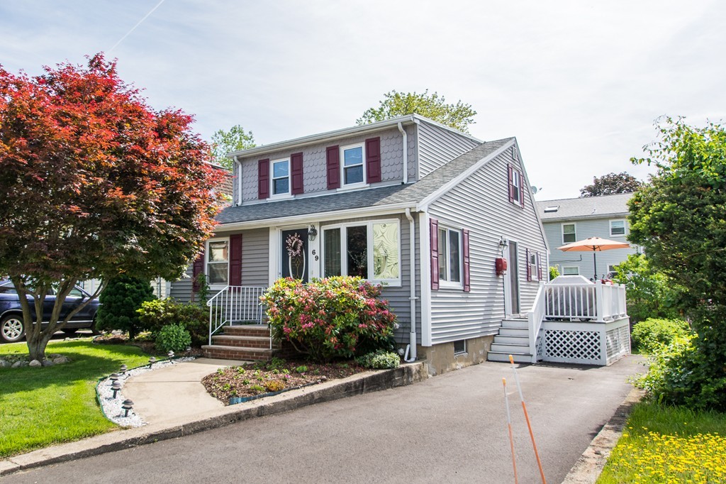 front view of a house with a yard