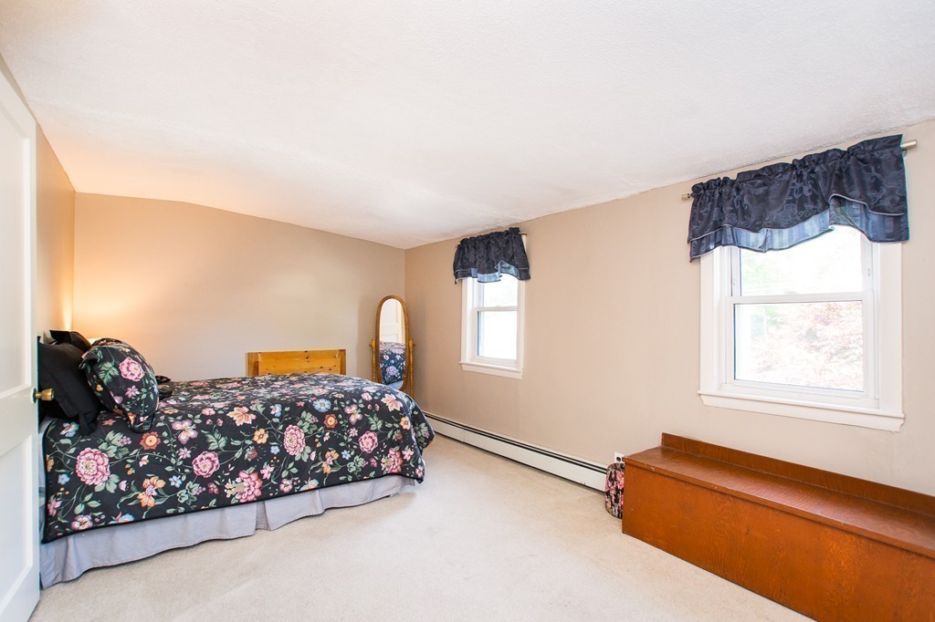 69 Lakeview Terrace Waltham, MA 02451 - Photo 11 of 17 a bed room with a bed and a couch