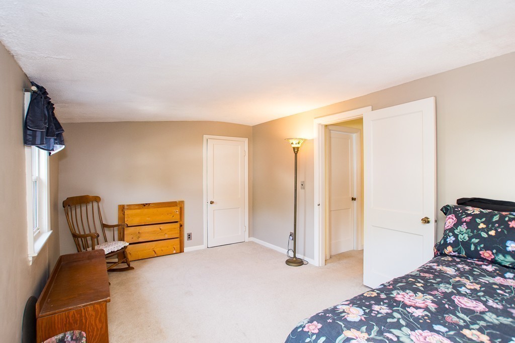 69 Lakeview Terrace Waltham, MA 02451 - Photo 12 of 17 a bedroom with furniture and a window