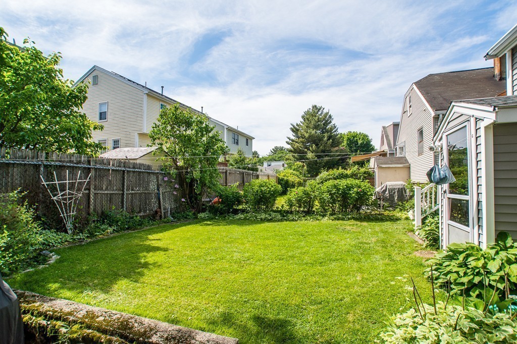 69 Lakeview Terrace Waltham, MA 02451 - Photo 15 of 17 a view of a garden in front of a house