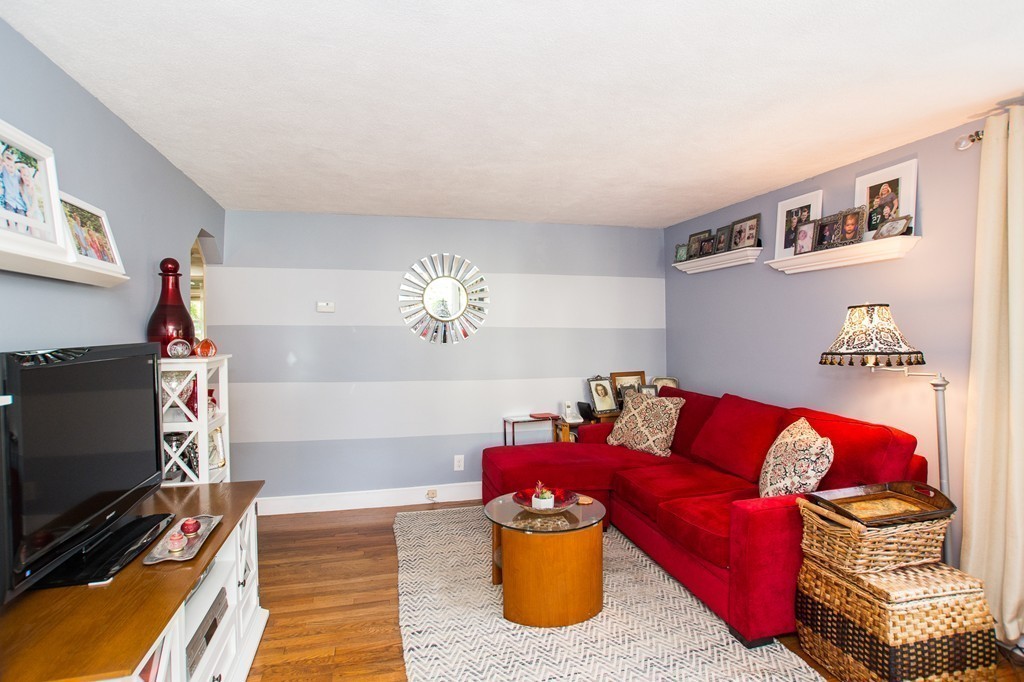 69 Lakeview Terrace Waltham, MA 02451 - Photo 3 of 17 a living room with furniture a flat screen tv and a window
