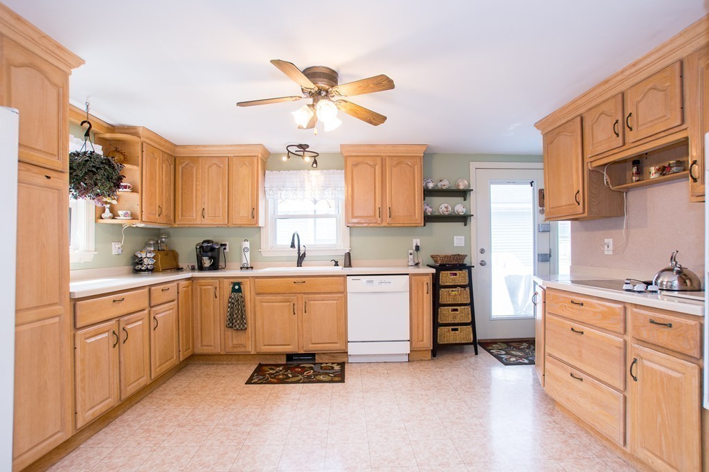 69 Lakeview Terrace Waltham, MA 02451 - Photo 4 of 17 a kitchen with cabinets appliances and a window