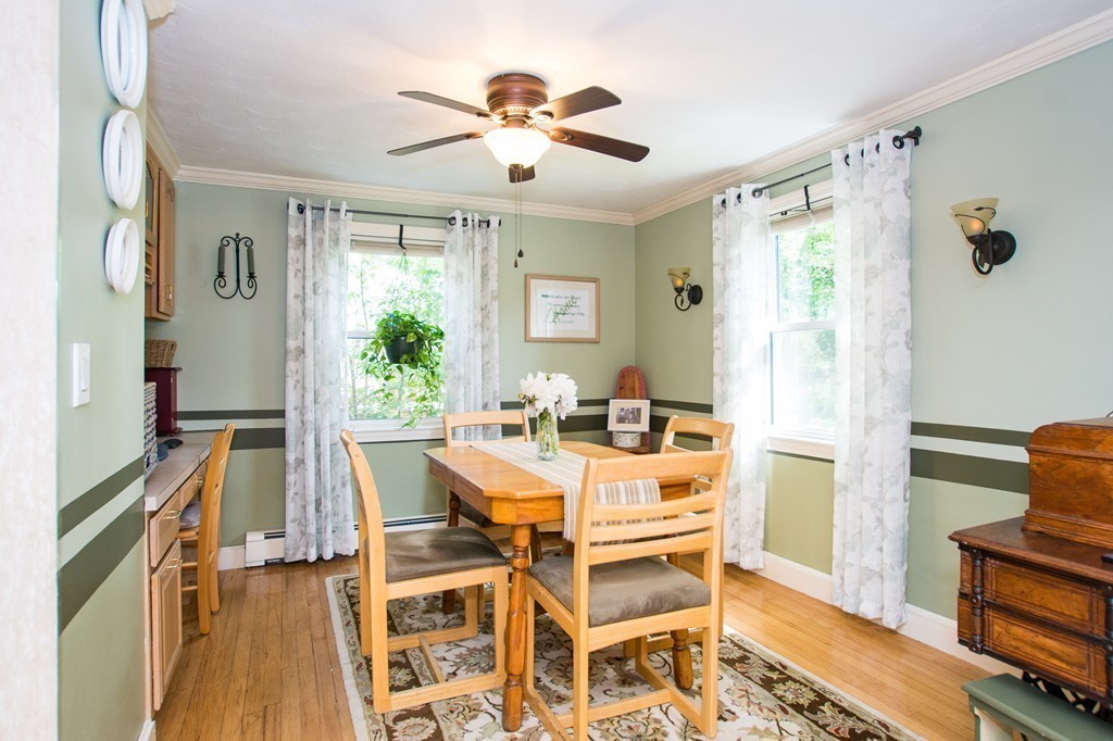 69 Lakeview Terrace Waltham, MA 02451 - Photo 6 of 17 a view of a livingroom with furniture wooden floor and a ceiling fan
