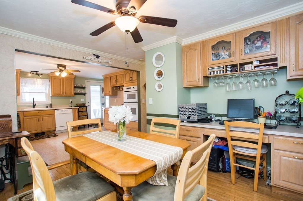 69 Lakeview Terrace Waltham, MA 02451 - Photo 7 of 17 a room with stainless steel appliances kitchen island granite countertop furniture and a fireplace