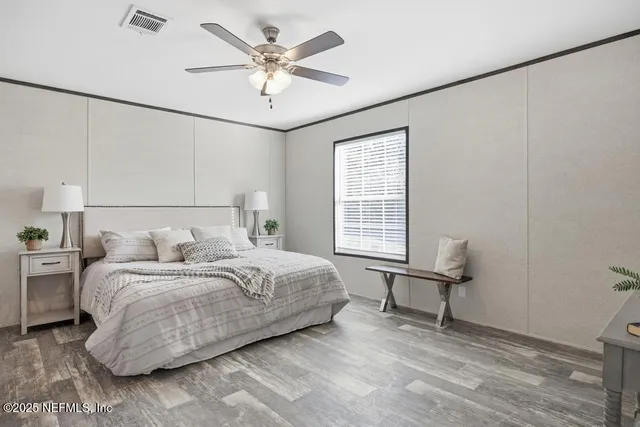 a kitchen with a stove and white cabinets