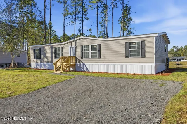 a front view of house with yard and porch
