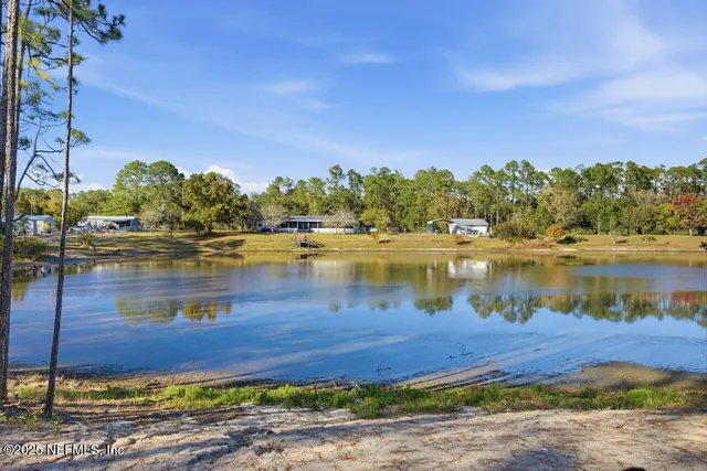 a view of a backyard of the house