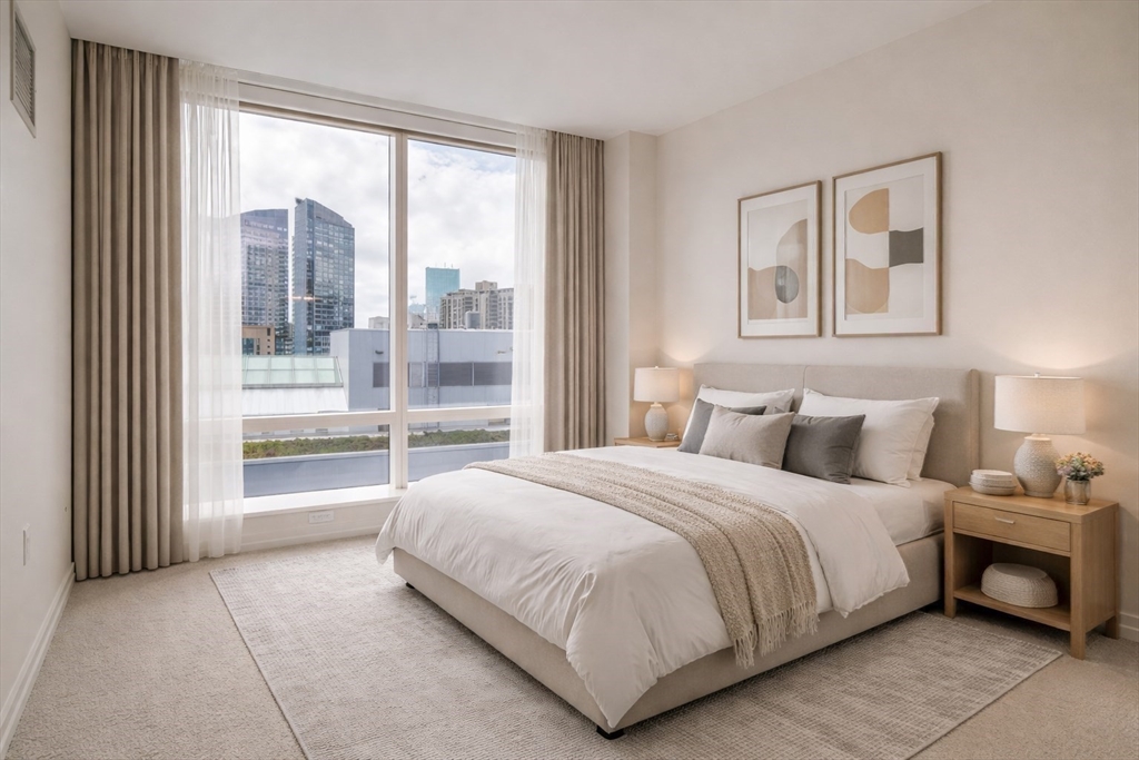 1 Franklin Street, Unit 1714 Boston, MA 02110 - Photo 6 of 10 a bedroom with a bed and a large window