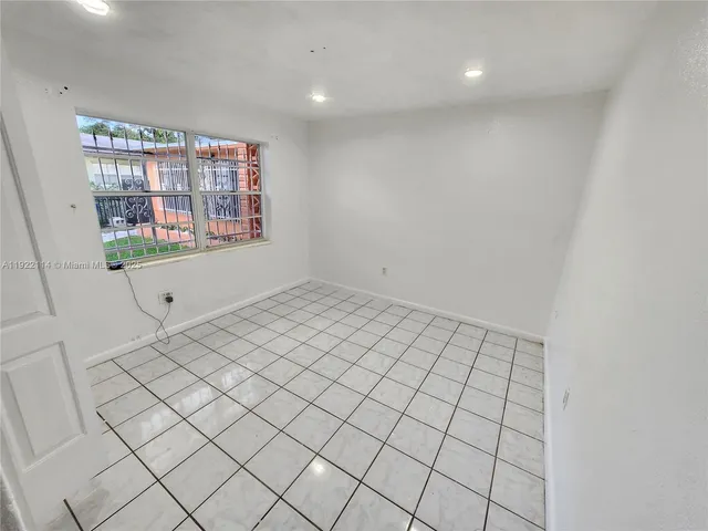 a view of an empty room and window