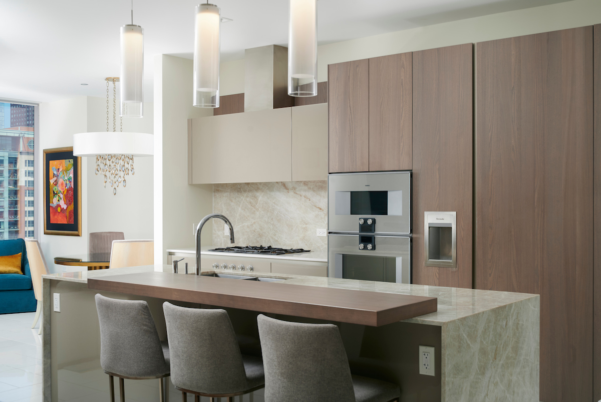 363 East Wacker Drive, Unit 1506 Chicago, IL 60601 - Photo 13 of 34 a kitchen with stainless steel appliances a sink and cabinets