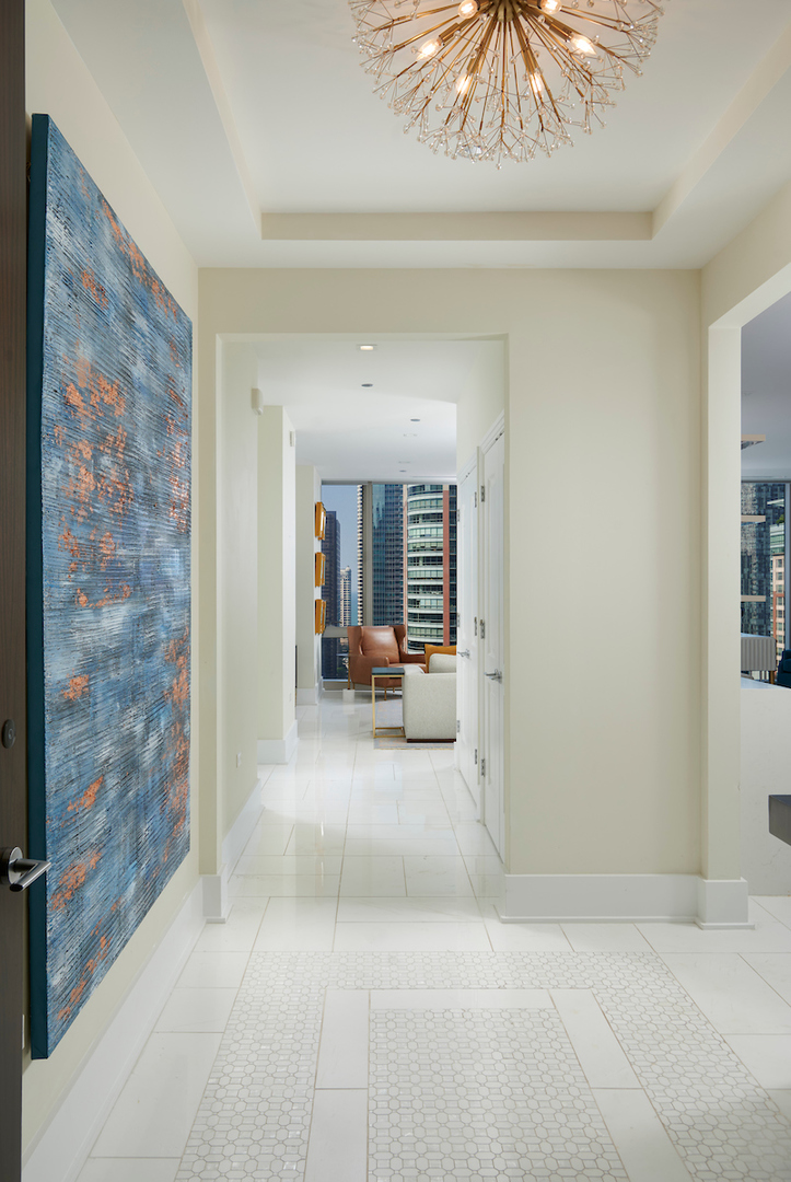 363 East Wacker Drive, Unit 1506 Chicago, IL 60601 - Photo 2 of 34 a view of a livingroom with a staircase