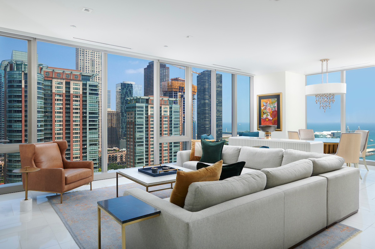 363 East Wacker Drive, Unit 1506 Chicago, IL 60601 - Photo 3 of 34 a living room with furniture and a large window