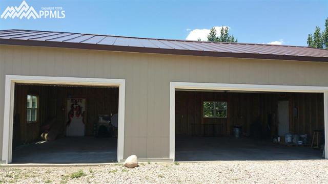 27055 Handle Road Calhan, CO 80808 - Photo 22 of 25 Looking inside the giant garage.