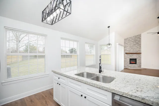 a kitchen with sink and window