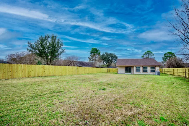 a view of a house with a big yard