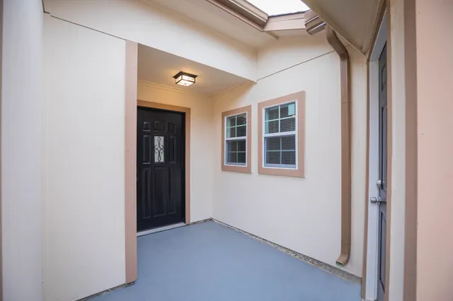 a view of empty room with windows