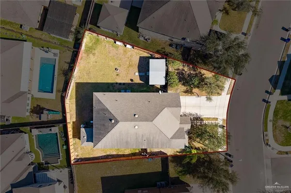 an aerial view of a house with table and chairs
